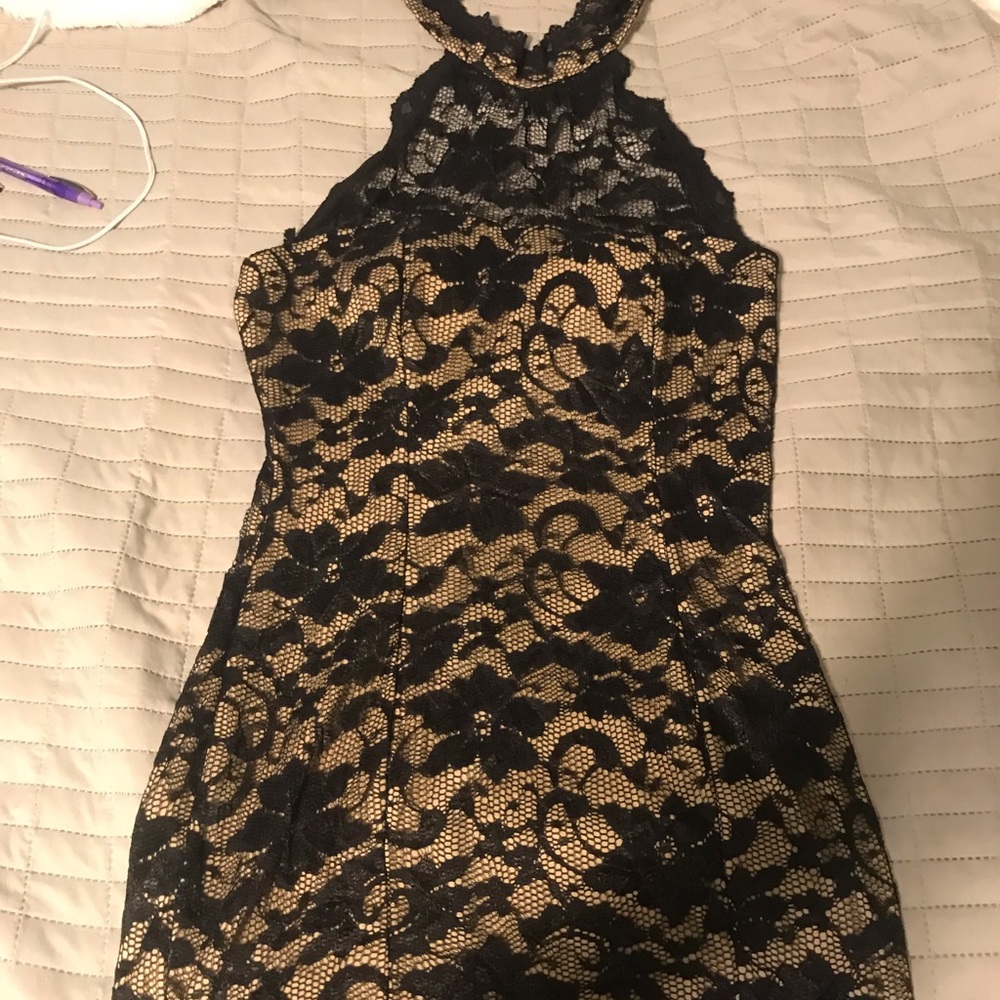 Fashion magazine gold and black lace dress